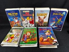 Walt Disney VHS Lot Of 7 Movies Clam Shell Pooh Pan Gordy Oliver Robin Dalmatian