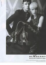 ADVERTISING 2008 BURBERRY AGYNESS DEYN carries a leather goods bag