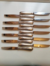 SUITE DE 12 COUTEAUX À