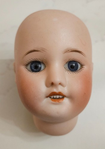 Tête poupée ancienne en - tête,