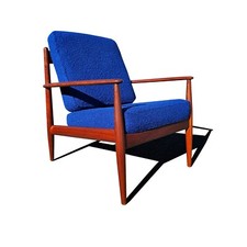 A Danish mid century modern teak wood Grete Jalk lounge chair