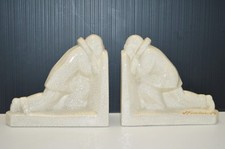 -PAIRE DE SERRE LIVRES EN CERAMIQUE CRAQUELEE ART DECO  L FONTINELLE  PIERROT