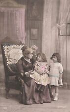 CP IN LIVING ROOM ELEGANT LITTLE GIRLS WITH GRANDMOTHER IN CHAIR