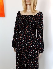 Superbe Robe noire fleurie mi-longue évasée. Taille M/38