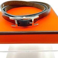 Bracelet long Hermès en cuir appliqué noir accessoires bijoux authentiques