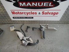 2013 Honda Cbr250r Repsol oem front footpeg brackets  14k miles