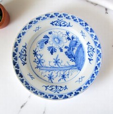 Delft. Earthenware dish blue flower shade decor on terrace, 18th century 