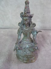 BUDDHISM: STATUETTE of TARA, holding a lotus flower.