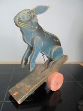 ANTIQUE WOODEN RABBIT JOINT TOY ON WHEELS