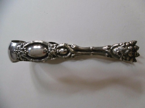 Pince sucre griffe de - a,