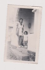 Snapshot Film Woman Standing With Her Daughter Exterior Door Frame