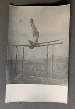 PHOTO men's bare chest athlete sports parallel bars gymnastics