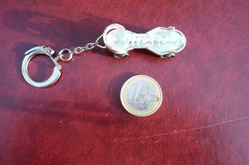 Porte cle plastic patin a - cle, /