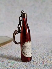 Antique keychain fountain pen in a bottle of champagne Clos des Rochers