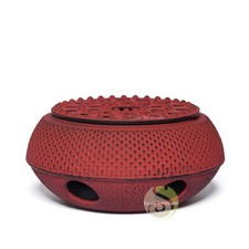 Chauffe théière en fonte