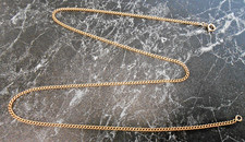 Chaine maille gourmette   en or  18 K  poincon  tete d aigle