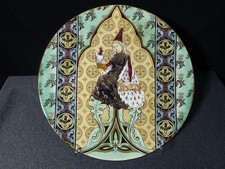 Plat rond ancien en faience de