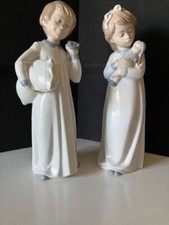 Lladro Nao pair Girl with doll and "Off to Bed" boy with repair