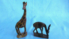 wooden giraffe and antelope sculpture