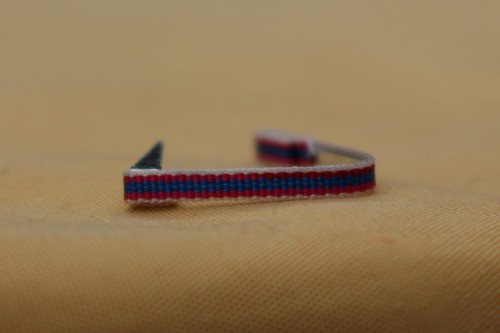 Fixe ruban rappel boutonnière