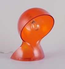 Vico Magistretti for Artemide. 'Dalu' table lamp in translucent orange plastic.