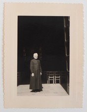 Father Claude Lenoir? religious priest entrance church light - photo snapshot