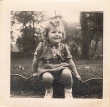 OLD PHOTOGRAPH CHILD POSING IN A PARK
