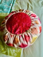 Joli coussin rond rouge/rose 