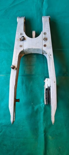 Bras oscillant avec balancier