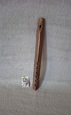 Flûte en bois sculpté