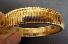 Bracelet femme Tubogas chaine serpent extensible en laiton plaqué or. Bon état