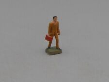 Figurine homme à la valise