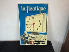 Antique advertising plate in Plexiglas clock, LA FIXATIQUE rest staple