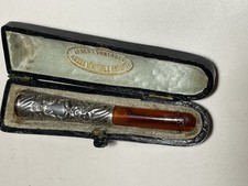 Ancien Fume-cigarette ambre or massif tête d'aigle et argent fourré XIXème