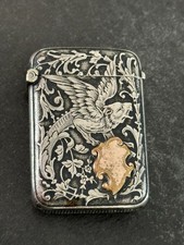 Antique silver pyrogen late 19th century with floral decorations and a griffin »