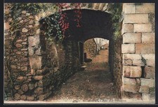 Old postcard Sospel, Rue des Romains with arcades and old cobblestones 