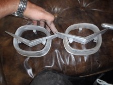 1959 CADILLAC ELDORADO FLEETWOOD BACK UP LIGHT BEZELS WITH THE V INSERT
