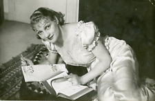 The actress Jeanne Boitel doing the crossword, ca.1950, vintage silver print