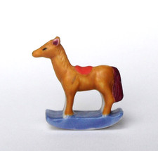 cyb  - fève mate jouet cheval à bascule -MAT