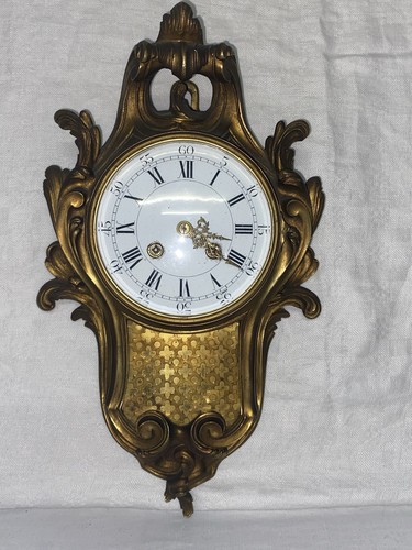 Cartel applique bronze - en,