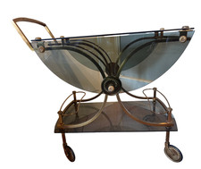 JANSEN Desserte ( bar roulant ) en laiton et bronze doré à plateaux rabattables