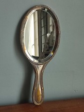 Miroir ancien face a main en metal argenté
