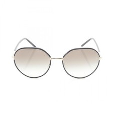 Lunettes de soleil PRADA plastique noir or unisexe d'occasion