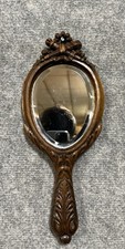 Miroir de courtoisie "face a main" en noyer mouluré, sculpté époque XIXeme