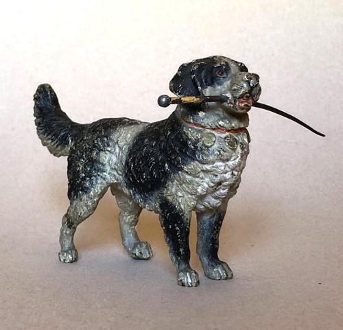 Chien portant une - canne, —