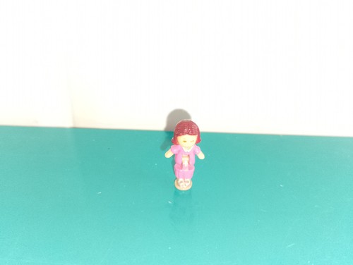 Polly pocket figurine doll