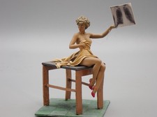 LEAD BASE ARTIST FIGURE???   WOMAN ON THE RADIO