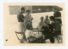 Snapshot photo Val d’Isère 1937, a group around a table terrace café »