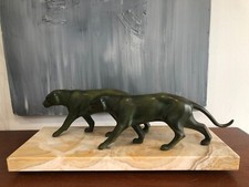 GROUPE DE PANTHÈRES MARCHANT