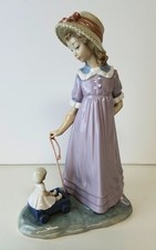 Lladro glazed "Girl with Toy Wagon" #5044 Sculptor: Vincente Martinez Retired